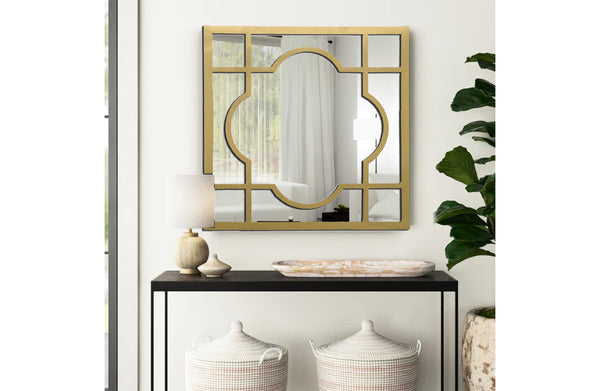 Gold Hampton’s square window style mirror styled above entryway console with décor.
