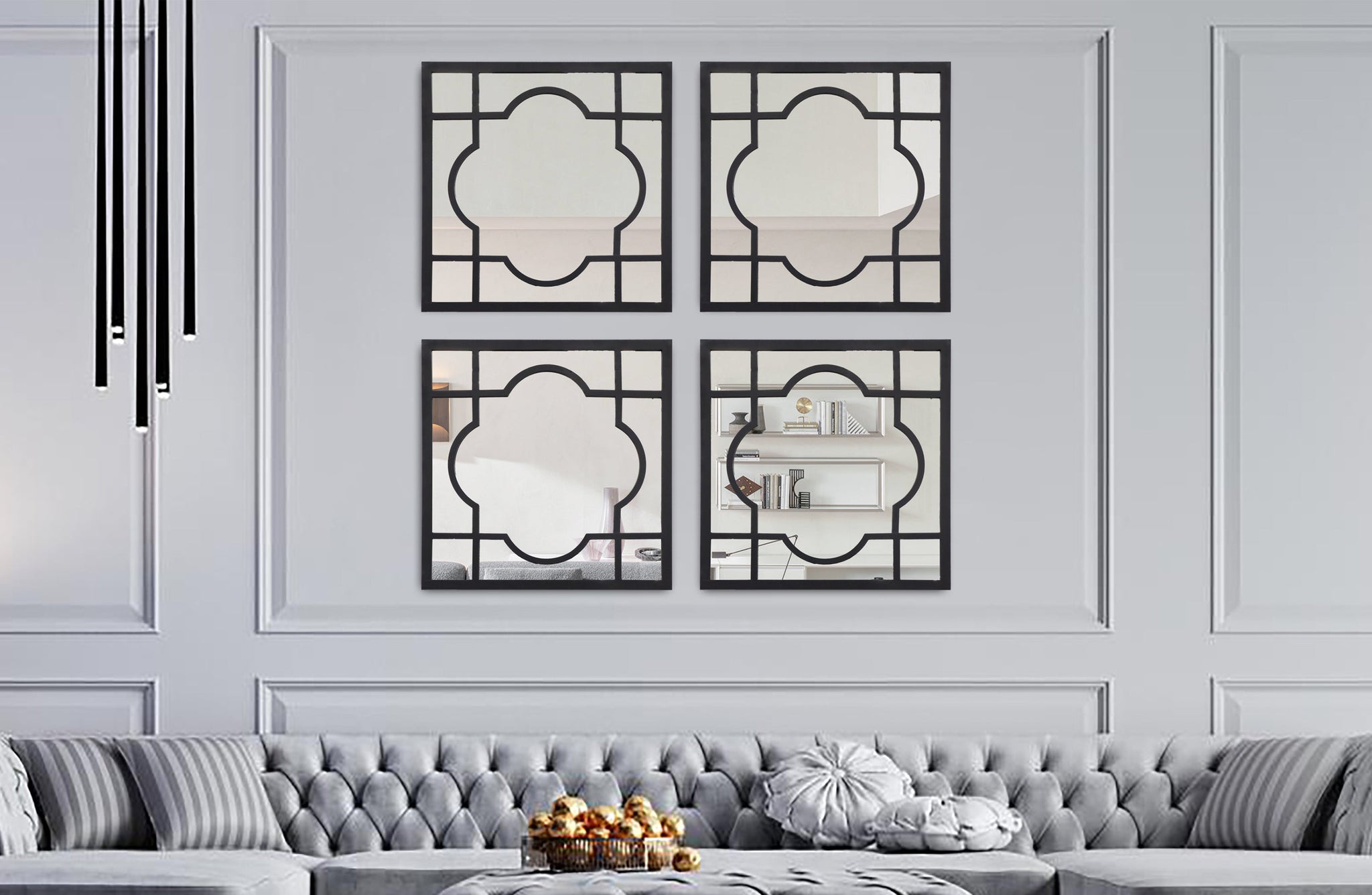 Set of four Hampton’s square window style mirrors styled above a grey sofa in living room.