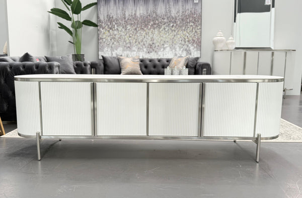 Elegant Kingsley TV Unit in white with silver trim, styled in a luxury living room.