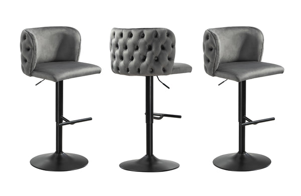 Pair of grey velvet bar stools with button tufted back and black stand, swivel design