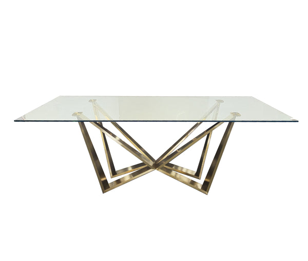 Lenox Dining Table with polished gold stainless steel frame and clear tempered glass top.