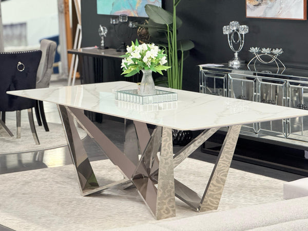 Lenox Dining Table silver frame with marble top styled in modern dining room setting.