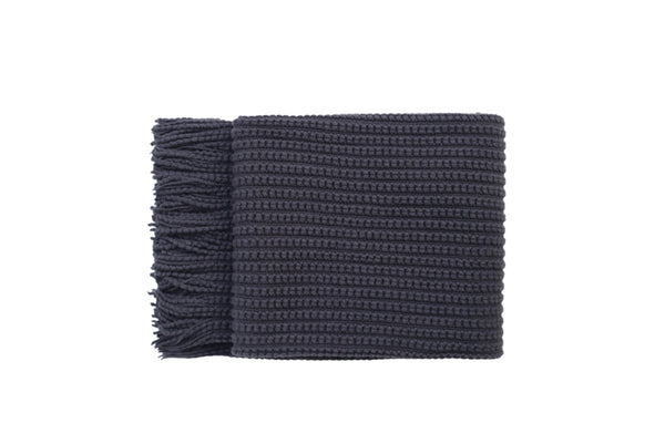 Levi Throw Rug Blanket in dark grey, neatly folded with soft fringe detailing.