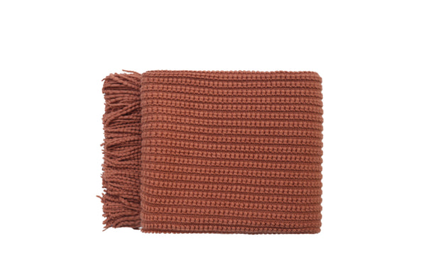 Levi Throw Rug Blanket in vibrant orange, neatly folded with soft fringe detailing.