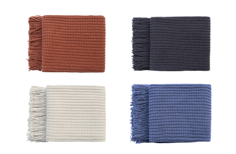 Levi Throw Rug Blankets in Dark Grey, Cream, Blue, and Orange neatly folded with fringe edges.
