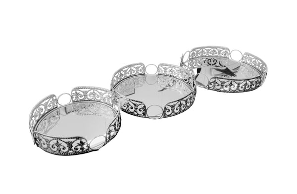 Elegant silver round Lucy tray set of 3 with intricate cutout design and mirrored base – timeless charm for any décor.