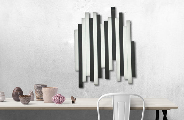 Luxe panel black mirror styled on wall above desk, adding contemporary depth and sophistication.