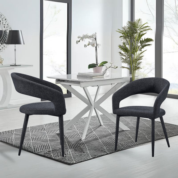 Marilyn boucle dining chairs in charcoal fabric styled with white dining table in a modern bright room.