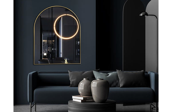 Gold small arch mirror 100cm styled above sofa with dark modern décor