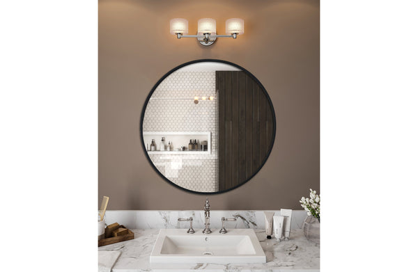 Sleek black round mirror styled above vanity with white basin and wall lights