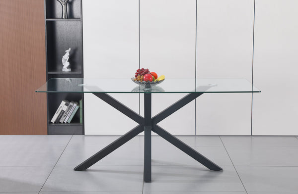Miles rectangle dining table with black metal frame and clear tempered glass top in a modern setting.