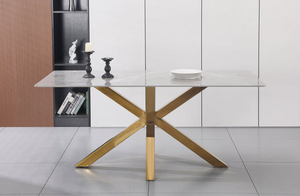 Miles rectangle dining table with polished gold frame and clear tempered glass top in a modern dining room.