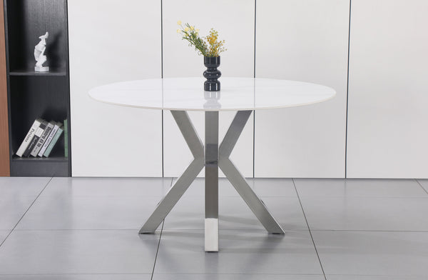 Miles round dining table with polished silver frame and marble top, versatile dining option.
