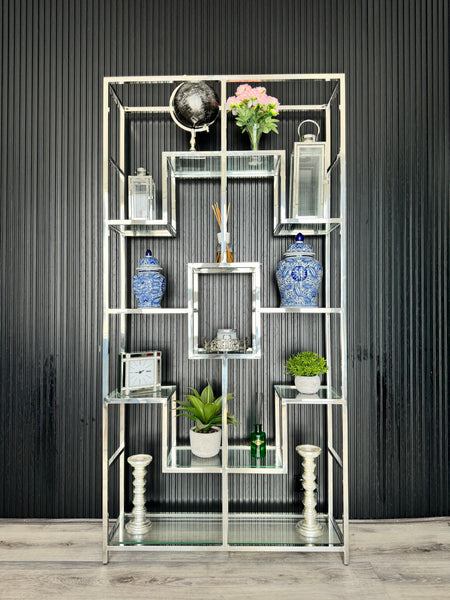 Silver Nelson Bookcase styled with decorative vases, plants, and books – a modern shelving unit showcasing a luxurious and organized interior setup.