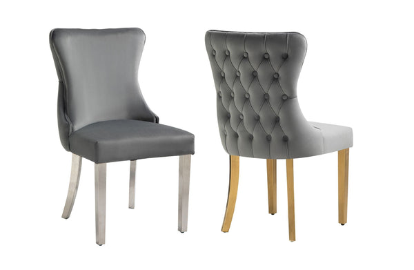 Grey velvet Paris chairs shown together with silver legs and gold legs, tufted back.