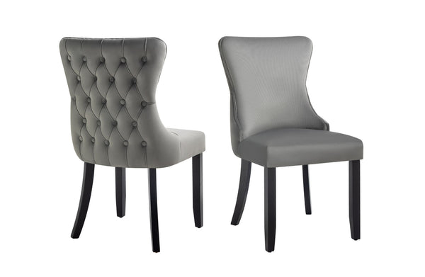 Grey velvet Paris dining chairs with tufted back and elegant rubberwood frame.