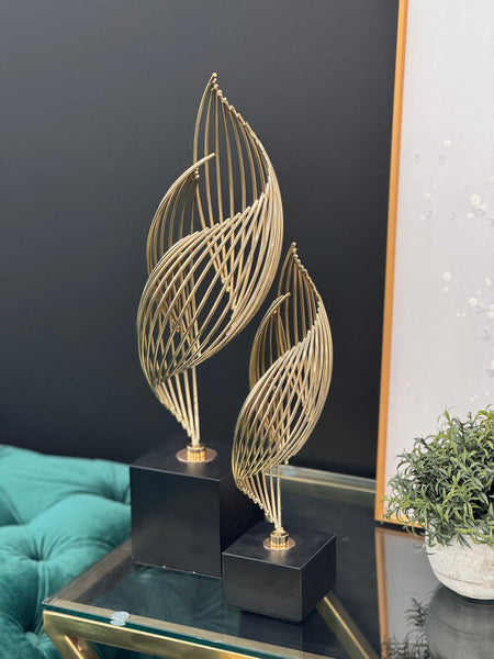 Gold Ribbon Table Décor set styled on a black tabletop with modern accents – a graceful blend of art and interior décor.