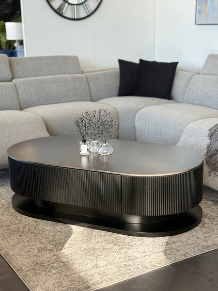 Black marble Ripple coffee table styled in living room adding bold modern luxury centrepiece