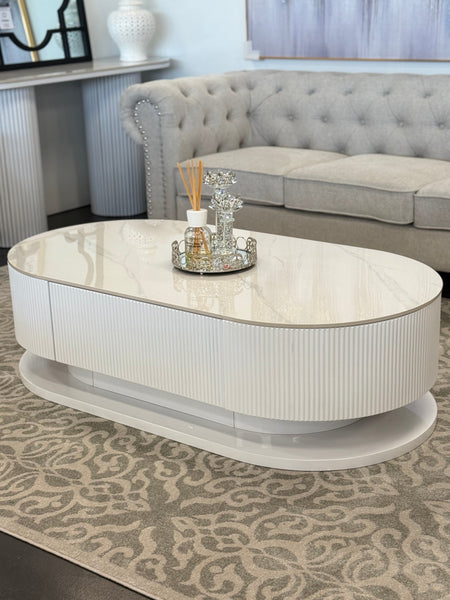 White marble Ripple coffee table styled in elegant lounge creating bright airy modern atmosphere