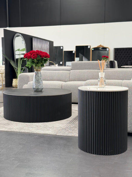 Ripple coffee and side table styled in living room with grey sofa and flowers