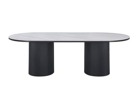 Ripple Oval Dining Table with white marble top and black base in modern style.