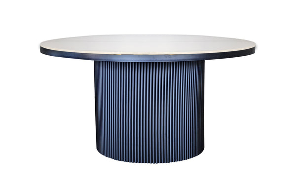 Ripple Round Dining Table with white marble top and ribbed black cylindrical base design.