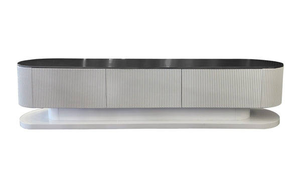 Elegant white ripple TV unit with bold black stone top accent