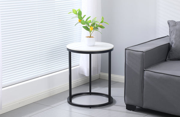 Romana Side Table styled in a modern living room with black frame and white marble top.