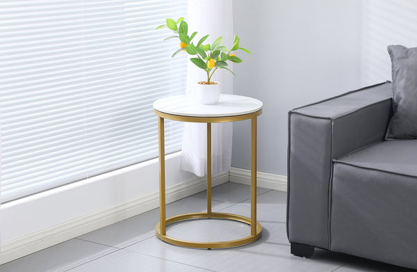 Romana Side Table in a living room setting with champagne frame and white marble top.