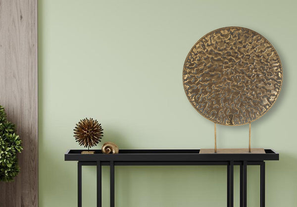  Elegant gold round pressed table décor styled on a console table for a luxe touch.
