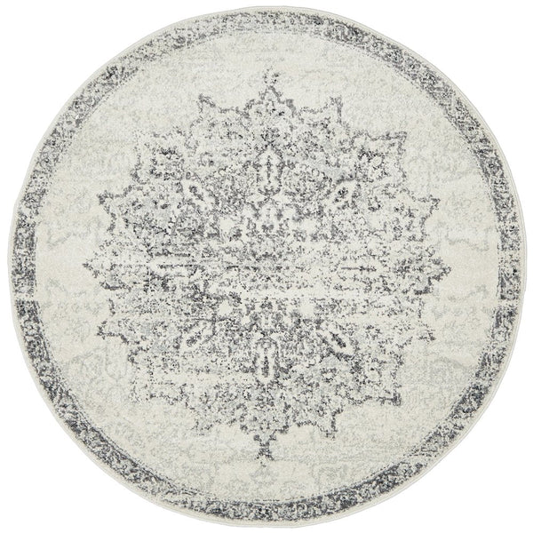 Elegant round silver rug with ornate floral patterns in grey and white tones – top view.