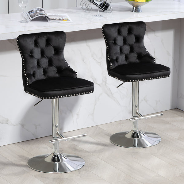 Pair of black velvet Sahara swivel bar stools with silver stand styled at marble kitchen bar