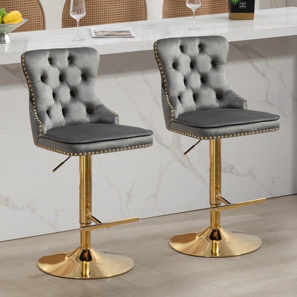 Set of grey velvet Sahara swivel bar stools with gold stand styled at white kitchen bar