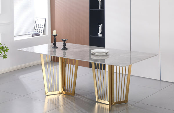 Serena Dining Table gold stainless frame with sophisticated grey marble top and modern design.