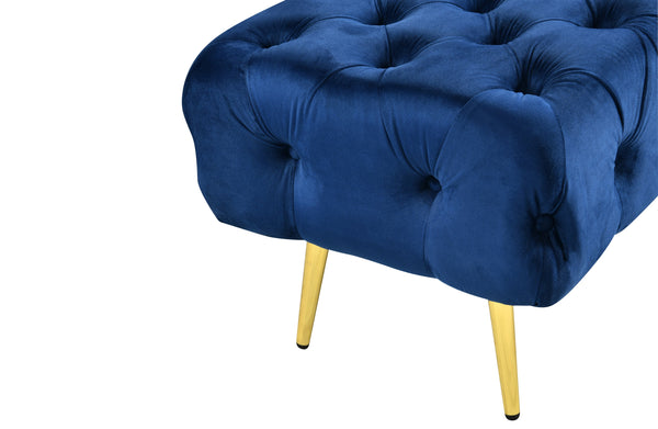 Close-up of Blue Shirley Ottoman featuring gold frame and tufted velvet detail for luxury style.