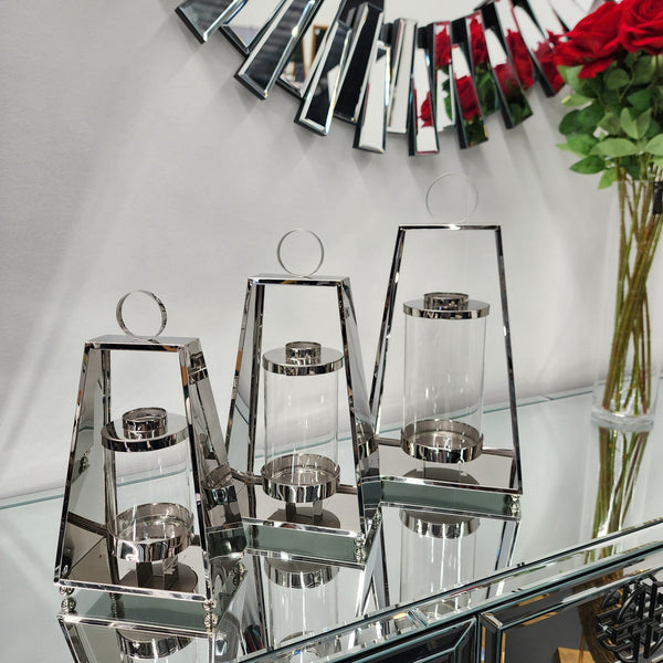 Silver tear-shaped lantern set on glass table – elegant steel frame with glass holder