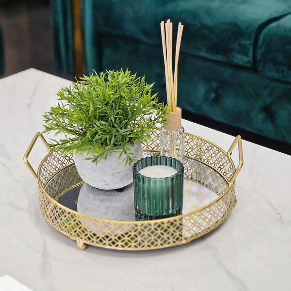 Gold Tegan tray styled with greenery and décor on tabletop.
