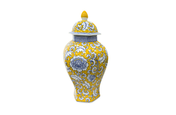 Bold yellow ceramic urn with intricate blue floral patterns, adding vibrant elegance to interiors.