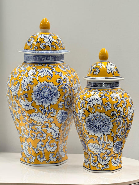 Decorative yellow and blue ceramic urn set displayed elegantly, adding charm and sophistication to any space.
