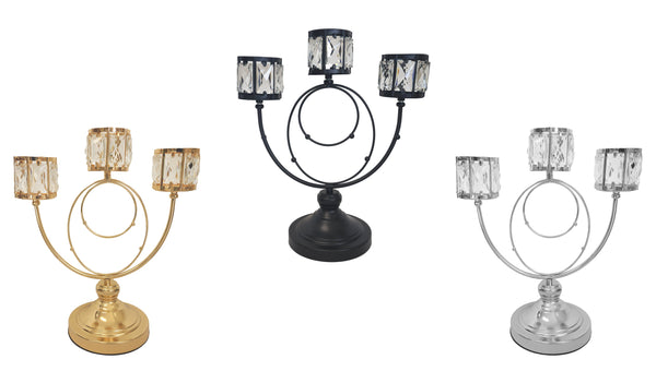Trio Crystal Candle Holders in gold, silver, and black finishes.
