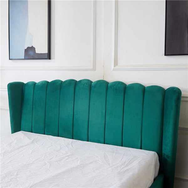Close-up of Vienna Bed headboard in peacock green velvet with elegant channel tufting.