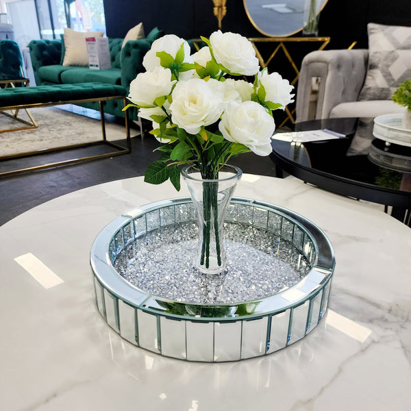 Round Vogue Diamond Tray styled with a flower pot, featuring a mirrored base and sparkling diamond border — a luxurious accent for elegant home décor.