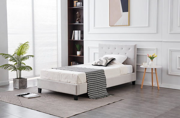 Side view of Winston Velvet Bed in light grey with plush velvet and tufted style.