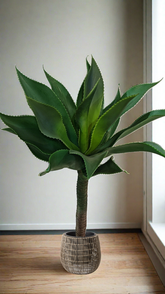 Artificial Yakka plant in decorative pot styled indoors for a natural, vibrant look.